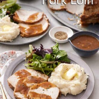 Pinterest graphic of a plate with a serving of Instant Pot pork loin with gravy, mashed potatoes, and salad. Another plated serving in the back along with more pork.