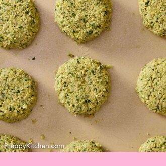 Pinterest graphic of multiple air fryer falafel before being cooked on a sheet pan in a single layer.