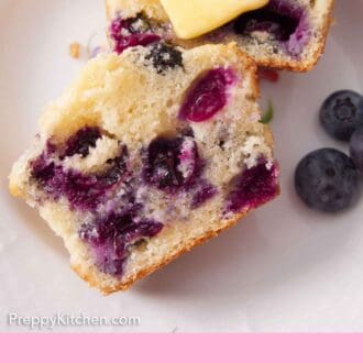 Pinterest graphic of a blueberry muffin cut in half on a plate, showing the middle with a knob of butter on one half.