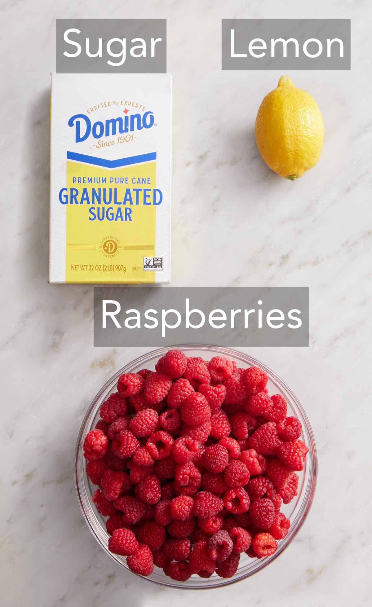 Ingredients needed to make raspberry jam.