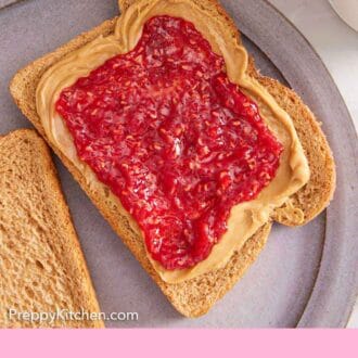Pinterest graphic of an overhead view of a piece of toast with peanut butter and raspberry jam.