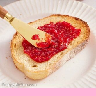 Pinterest graphic of raspberry jam spread onto a piece of bread.