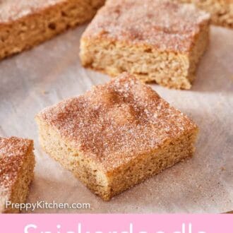 Pinterest graphic of snickerdoodle bars sliced from the slab on parchment paper.