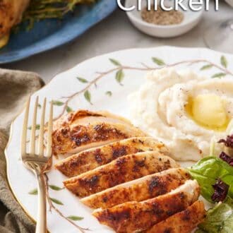 Pinterest graphic of a plate with a spatchcock chicken breast sliced with some mashed potatoes, mixed greens, and a fork.