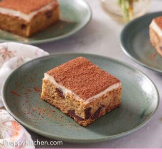 Pinterest graphic of plated serving of pieces of tiramisu blondies.