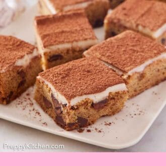 Pinterest graphic of multiple pieces of tiramisu blondies on a plate.