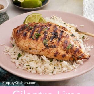 Pinterest graphic of a plate with a cilantro lime chicken on top of a bed of rice with a fork.