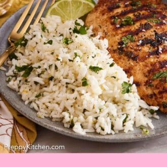 Pinterest graphic of a plate of cilantro lime rice with a chicken breast and cut limes with a fork.
