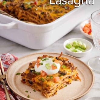 Pinterest graphic of a plate with a serving of Mexican lasagna with a baking dish in the background with the rest of the lasagna.