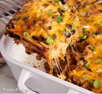 Pinterest graphic of a slice of Mexican lasagna lifted from a baking dish.
