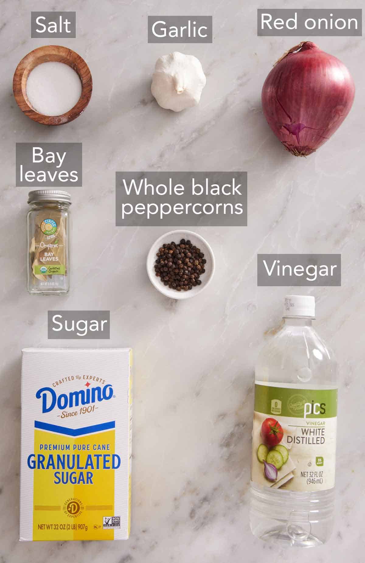 Ingredients needed to make pickled red onions.