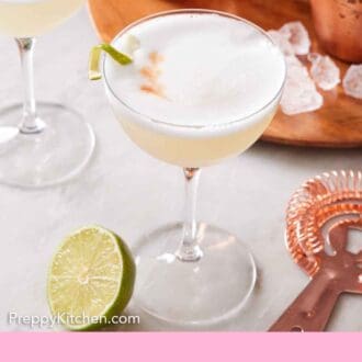 Pinterest graphic of two glasses of pisco sour cocktails with a lime garnish.