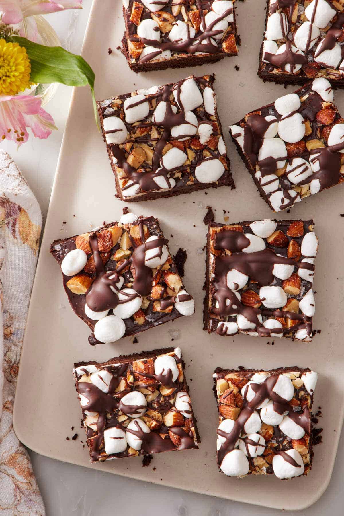Overhead view of eight rocky road bars on a serving platter.