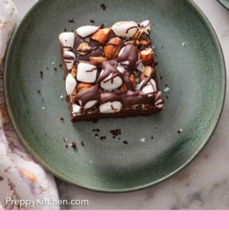 Pinterest graphic of overhead view a piece of rocky road bar on a green plate.