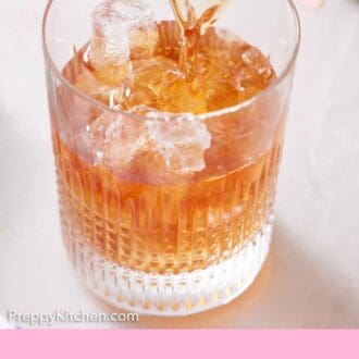 Pinterest graphic of Vieux Carré strained from a cocktail shaker into a glass with ice.