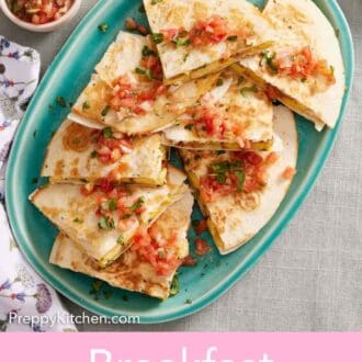 Pinterest graphic of a platter of breakfast quesadillas topped with pico de gallo. A bowl of pico de gallo, guacamole, and sour cream on the side.