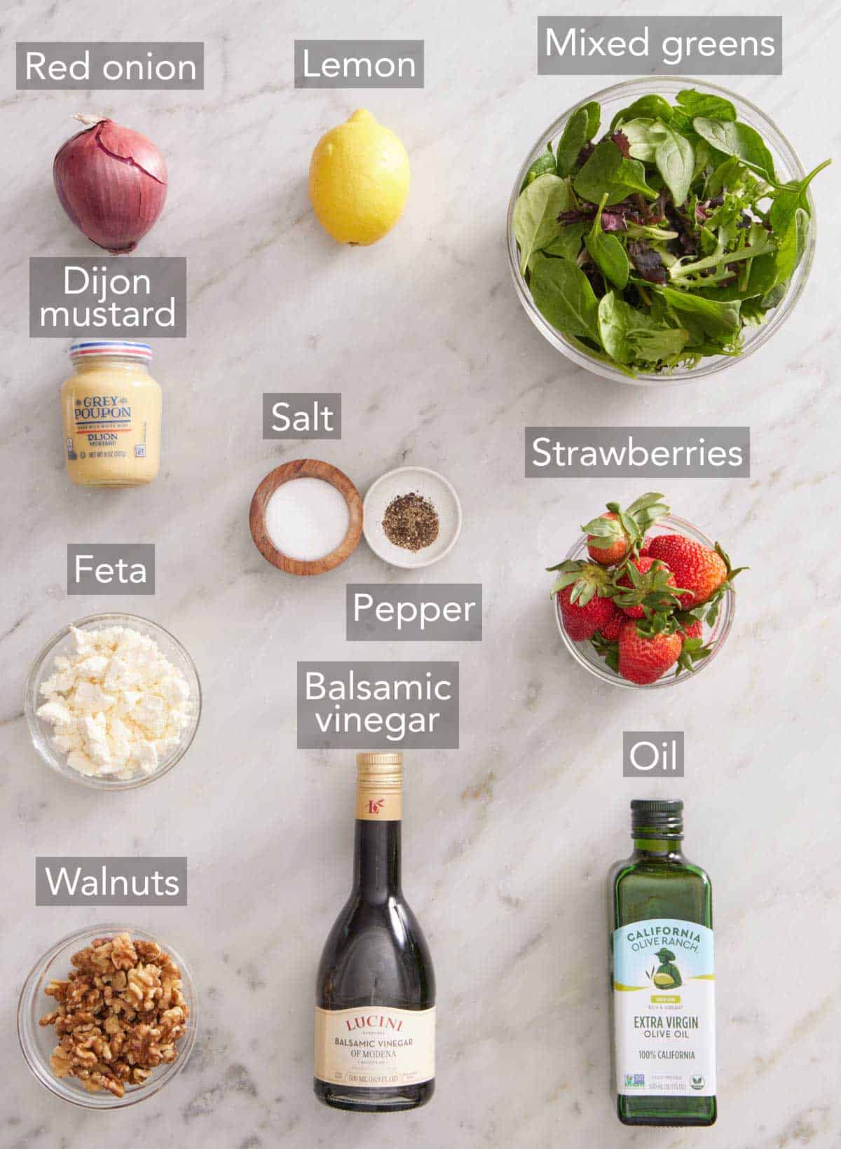 Ingredients needed to make a strawberry salad.