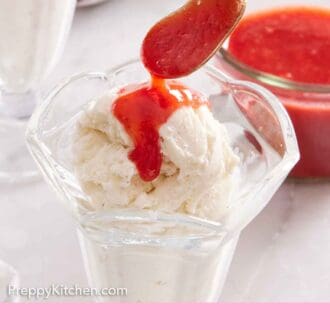 Pinterest graphic of a spoonful of strawberry sauce spooned over a tall glass of ice cream.