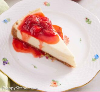 Pinterest graphic of a plate with a slice of cheesecake with strawberry sauce.