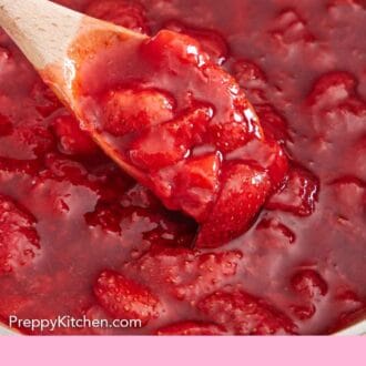 Pinterest graphic of a wooden spoon scooping out some strawberry sauce in a pot.