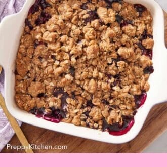 Pinterest graphic showing an overhead shot of a crisp made with berries.