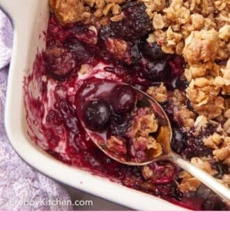 Pinterest graphic showing a close up of a fruity crisp with some scooped out.