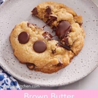 Pinterest graphic showing a brown butter chocolate chip cookie on a plate, split in half to show off the melty chocolate.