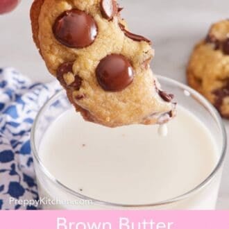 Pinterest graphic showing a brown butter chocolate chip cookie dipped in milk.