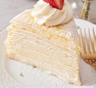 Pinterest graphic of a close-up of a slice of crepe cake with all the delicate layers visible. It is topped with whipped cream and a strawberry half, and set on a plate with a fork.