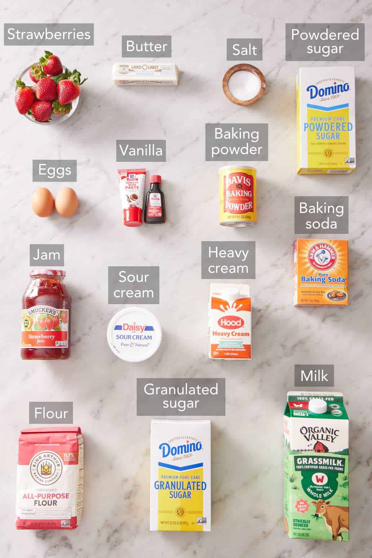 Ingredients needed to make strawberry shortcake cupcakes.