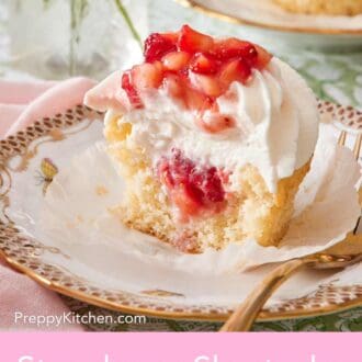 Pinterest graphic showing a halved strawberry shortcake cupcake to showcase the berry filling.