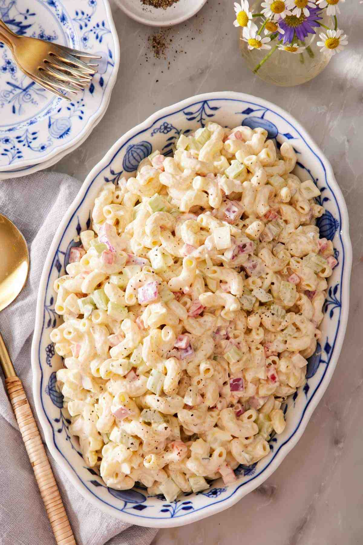 Overhead view of a large serving dish of macaroni salad.