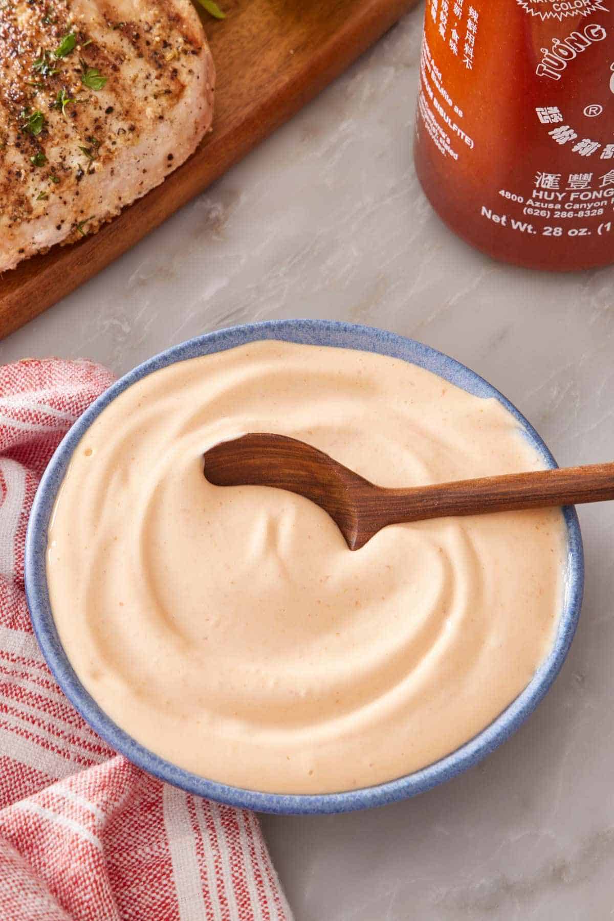 Homemade spicy mayo with sriracha in a small bowl.