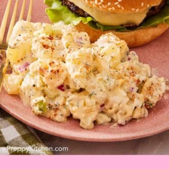 Pinterest graphic showing spud salad on a plate with a burger.