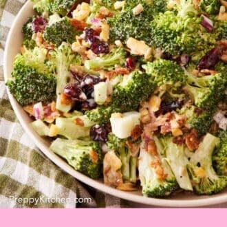 Pinterest graphic showing a close-up of broccoli salad in a white ceramic bowl.