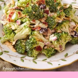 Pinterest graphic showing a close up of broccoli salad on a white plate patterned with leaves.