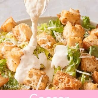 Pin image showing creamy dressing drizzled over a Caesar salad.