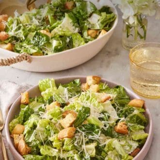 Pinterest graphic showing a plate with Caesar salad with a drink on the side.