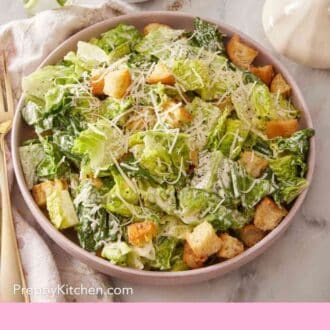 Pinterest graphic showing a serving of Caesar salad on a plate.