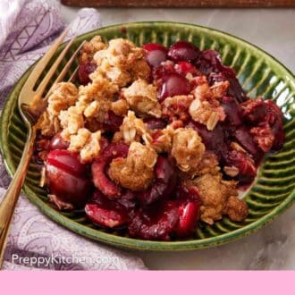 Pinterest graphic showing a bowl of cherry crisp with a gold fork.
