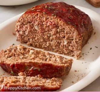 Pinterest graphic showing meatloaf with two slices cut out.