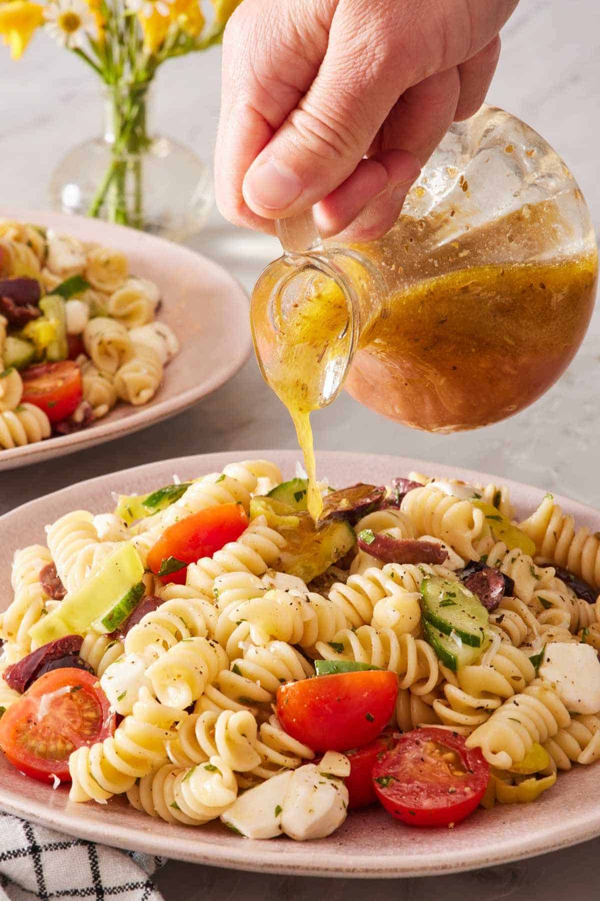 Vinegary dressing poured over a light pasta salad.
