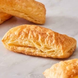 Close up of strips of baked puff pastry.