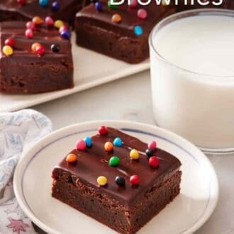Pinterest graphic showing a cosmic brownie on a plate with the rest of the batch in the background.