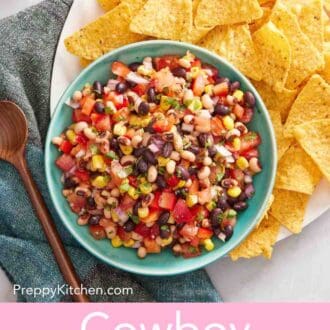 Pinterest graphic showing an overhead shot of a bowl of cowboy caviar on a platter with chips.