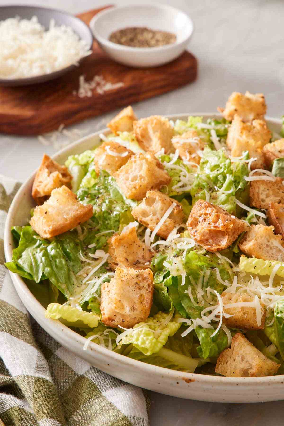 Caesar salad topped with croutons and cheese.