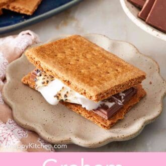 Pinterest graphic showing a s'more made with homemade graham crackers.