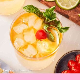Pinterest graphic showing an overhead shot of a mai tai cocktail surrounded by garnish options.