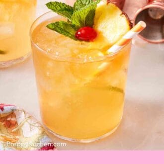 Pinterest graphic showing a mai tai in a rocks glass with a straw.
