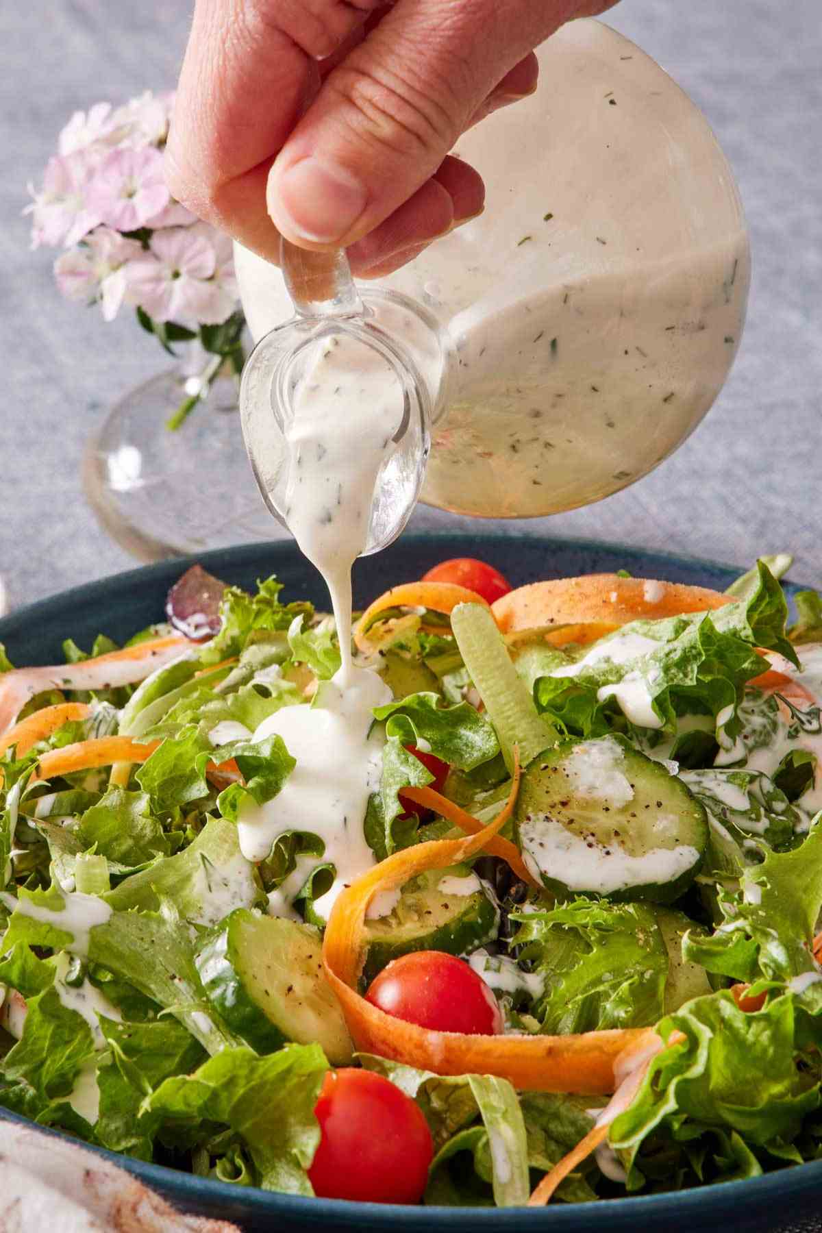 Homemade ranch poured over a salad.